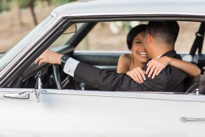 muscle car with bride and groom at the edwards estate