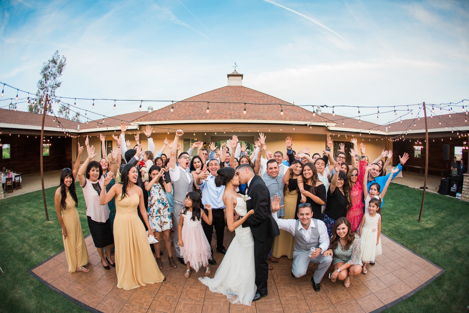Bride and groom on dance floor with guests at The Nirvana Estate in Bakersfield, Ca