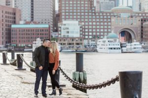 engagement session in seaport boston, couple kissing on the dock
