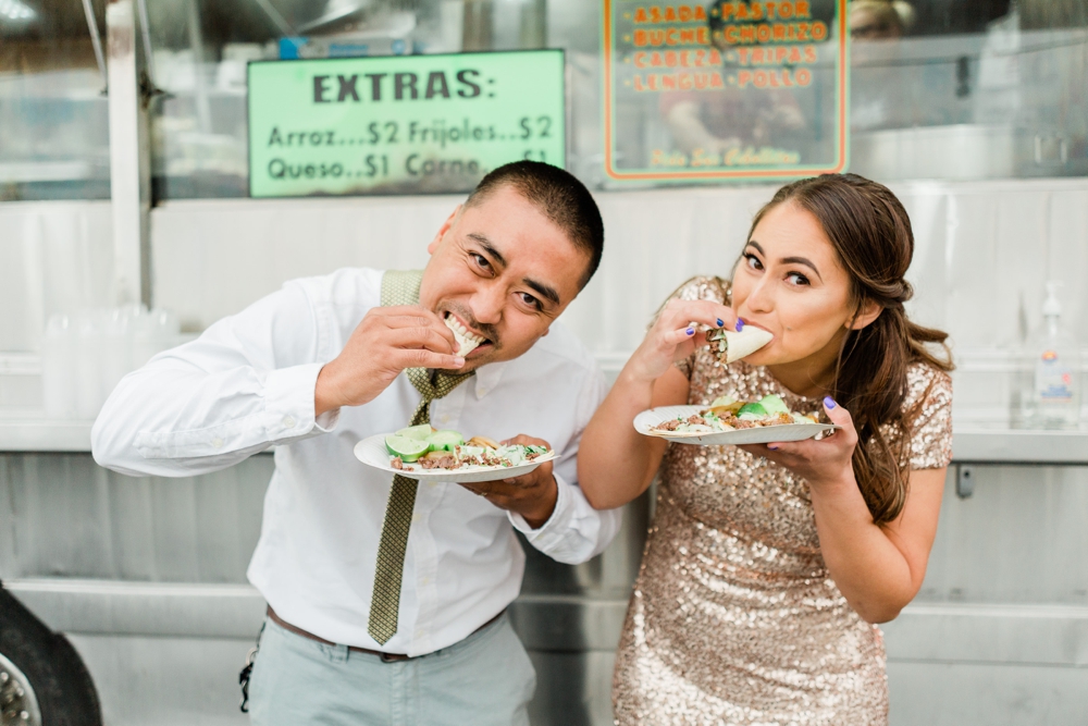 just married couple eating tacos from a taco truck